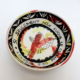 Bol en céramique artisanale, décor coloré et original avec motif de oiseau, une pièce unique et expressive.